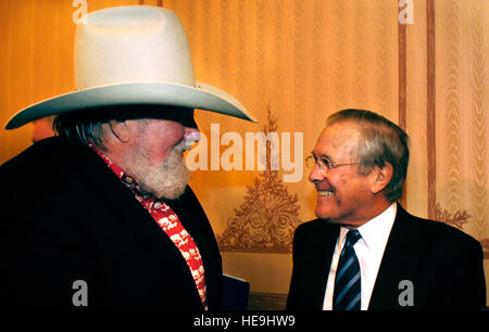 Defense Secretary Donald H. Rumsfeld and country music singer Charlie Daniels meet prior to the Veterans of Foreign Wars (VFW) convention in Reno, Nev. Aug. 28, 2006. Rumsfeld and Daniels are being awarded by VFW for their work with the US armed forces. Dept. of Defense  U.S. Air Force Staff Sgt. D. Myles Cullen (released) Stock Photo