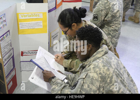 U.S. Army Soldiers assigned to 16th Combat Aviation Brigade judge a science fair at Tillicum Elementary School in Lakewood, Wash., Feb. 4. This event was part of 16th CABs ongoing efforts in the community dedicated to maintaining a strong partnership with local citizens. Stock Photo