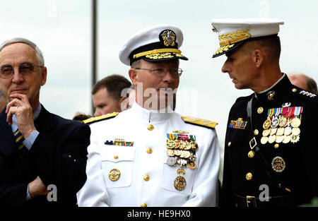 U.S. Marine Corps Gen. Peter Pace, chairman of the Joint Chiefs of Staff, speaks with U.S. Navy Adm. Edmund Giambastiani, Jr., vice chairman of the Joint Chiefs of Staff,as they walk with Deputy Defense Secretary Gordon England to attend a wreath laying ceremony at the Pentagon, Sept. 11, 2006.  On the fifth anniversary of the terrorist attack against the U.S., President George W. Bush laid a wreath at the crash site of Flight 77 and met with family members of those who lost their lives at the Pentagon on 9/11.   Defense Dept.  U.S. Air Force Staff Sgt. D. Myles Cullen (released) Stock Photo