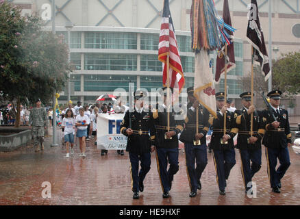 The joint color guard from nearby Fort Sam Houston marches down the street near the Alamo Dome leading more than 1,200 servicemembers, civilians and children who participated in the America Supports You Freedom Walk held in downtown San Antonio Sept. 11 to pay tribute to those who died on Sept. 11, 2001. Tech. Sgt. Phyllis Duff) Stock Photo