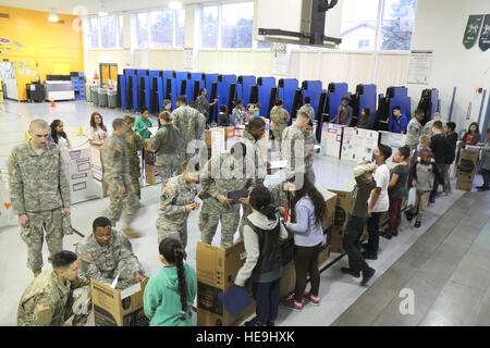 U.S. Army Soldiers assigned to 16th Combat Aviation Brigade judge a science fair at Tillicum Elementary School in Lakewood, Wash., Feb. 4. This event was part of 16th CABs ongoing efforts in the community dedicated to maintaining a strong partnership with local citizens. Stock Photo