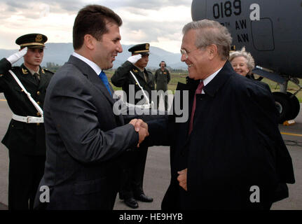 Secretary of Defense Donald H. Rumsfeld is greeted by Albanian Minister of Defense Fatmir Mediu while at Tirana Albania, Sept. 26, 2006. Secretary Rumsfeld is visiting Albania to attend the South Eastern European Defense Ministerial, to recognize and encourage AlbaniaÕs continuing efforts to join NATO and thank them for their troopsÕ performance in Iraq and Afghanistan.  U.S. Air Force civilian James M. Bowman. Stock Photo