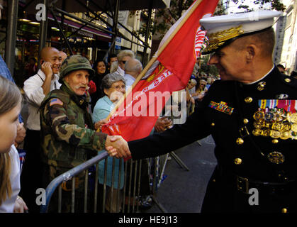 Gen. Peter Pace, chairman of the Joint Chiefs of Staff, shakes hands with a retired Marine during the Columbus Day Parade along Fifth Avenue in New York, Monday, Oct. 9, 2006. Gen. Pace, who was born in Brooklyn, New York to Italian-American parents, was selected by the Columbus Citizens Foundation to be the Grand Marshal. Defense Dept.  U.S. Air Force Staff Sgt. D. Myles Cullen (released) Stock Photo