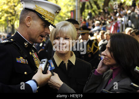 Chairman of the Joint Chiefs of Staff Marine Gen. Peter Pace and his wife, Lynne, are stopped for an interview during the Columbus Day Parade in New York, N.Y., Oct. 9, 2006. Pace was selected by the Columbus Citizens Foundation to be the Grand Marshal.  Staff Sgt. D. Myles Cullen, U.S. Air Force. (Released) Stock Photo