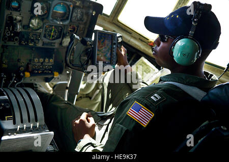 U.S. Coast Guard Lt. Randall Black, HC-130H Hercules pilot, flies over the Bering sea June 28, 2012, in-route to Barrow, Alaska. Coast Guardsmen from Air Station Kodiak are flying daily missions to Barrow, Alaska in preparation for a U.S. Coast Guard deployment Arctic Shield. Arctic Shield is a forward deployed temporary air station operating from Barrow in the Arctic Ocean during the summer to increase search and rescue response times in the region. ( U.S. Air Force Tech. Sgt. Michael R. Holzworth Stock Photo