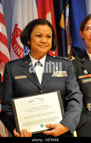 Air Force Lt. Col. Susan Pangelinan from the California National Guard is awarded a DOD Science, Technology, Engineering and Math award March 19 at the Women in Military Service for America Memorial, Arlington, Va., for her accomplishments as a medical adviser to the California Guard's Joint Forces Headquarters. The awards ceremony honored 10 service members who have worked toward the development of women and minorities in foreign languages and the STEM fields. It coincides with many other programs, ceremonies and activities that are observing women's history this month. Stock Photo