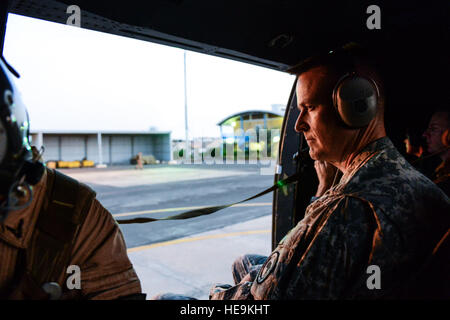 U.S. Army Col. Christopher Beckert, Combined Joint Task Force-Horn of Africa (CJTF-HOA), sits aboard a French SA330 Puma helicopter destined for the French Desert Combat Training and Hardening Center, Djibouti, March 6, 2013. The 5th French Marine Regiment invited members of CJTF-HOA to participate in the Desert Combat Training Course to help strengthen the partnership between the military allies.  Airman 1st Class Nicholas Byers Stock Photo