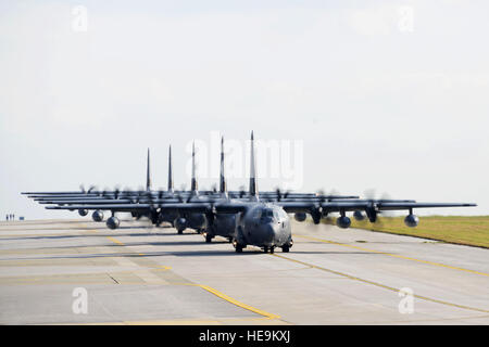 U.S. Air Force MC-130J Command IIs assigned to the 17th Special Operations Squadron taxi down the runway Feb. 17, 2016, at Kadena Air Base, Japan. The 17th SOS conducted a unit-wide training exercise which tasked the entire squadron with a quick-reaction, full-force sortie involving a five-ship formation flight, cargo drops, short runway landings and takeoffs, and helicopter air-to-air refueling.  Master Sgt. Kristine Dreyer, 353 SOG PA Stock Photo