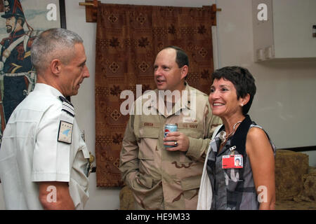 US Navy Rear Admiral Anthony Kurta talks with French Col Jean Cremedis and Mrs Cremedis during a dinner party at Camp Lemonier, Djibouti, Jan 24, 2009. RADM Kurta is the incoming commander of CJTF HOA. Camp Lemonier is the hub of the Combined Joint Task Force, Horn of Africa, providing humanitarian relief, security and anti-terrorism activities to the nations in the Horn of Africa. Stock Photo