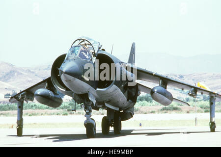 An AV-8A Harrier aircraft from Marine Attack Squadron 513 (VMA-513) practices landing and taking off on South Mesa Road during a training exercise. Stock Photo