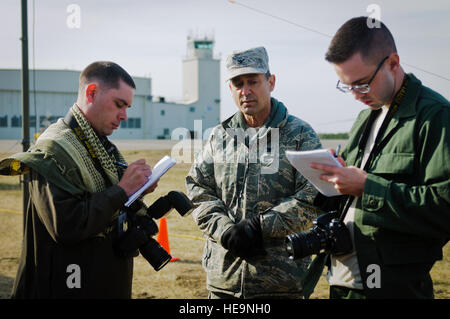 Col. Warren Hurst, commander of the Kentucky Air National Guard’s 123rd Contingency Response Group and the Joint Task Force-Port Opening unit at Eagle Flag, speaks with simulated reporters Mu’adh Zaki Fahd (left) and Jonny Walker on March 28, 2012. The Kentucky group and the U.S. Army’s 690th Rapid Port Opening Element from Fort Eustis, Va., joined forces during the exercise, which is being held at Joint Base McGuire-Dix-Lakehurst, N.J., through March 30.  Master Sgt. Phil Speck) Stock Photo