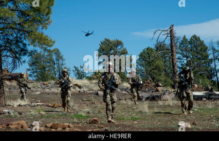 United States Air Force pararescue jumpers  participate in a mass casualty exercise during Exercise Angel Thunder, Camp Navajo, Flagstaff, Ariz., May 9, 2014. Angel Thunder is a multilateral annual exercise that supports the DOD's training requirements for personnel recovery responsibilities through high-fidelity exercises. AT provides the most realistic PR training environment available to U.S. Air Force rescue forces as well as their joint, interagency and coalition partners.  Tech. Sgt. Bradley C. Church) Stock Photo