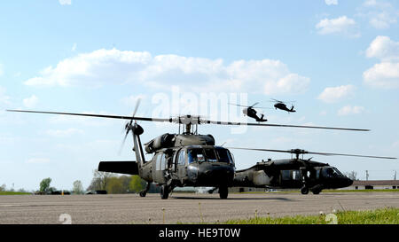 Members from the 1st Combat Aviation Brigade, 1st Infantry Division, Fort Riley, Kan., including Brigade Commander, Col. Matthew R. Lewis, arrived from Fort Riley in six UH-60 Black Hawks May 2 to support Exercise Vibrant Response 15, a 616-member Defense Chemical, Biological, Radiological, Nuclear Response Force command post exercise, at Camp Atterbury, Ind. The exercise tests the capabilities of the federal response to meet the expectations of the nation. It provides realistic training to prepare CBRN response units to integrate with civilian partners and respond to natural or manmade catast Stock Photo