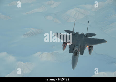 A United States Air Force F-15C Eagle from the 144th Fighter Wing, California Air National Guard flies over the High Arctic during Exercise Vigilant Shield 16, Oct. 22, 2015. From Oct. 15-26, 2015, approximately 700 members from the Canadian Armed forces, the United States Air Force, the United States Navy, and the United States Air National Guard are deploying to Iqaluit, Nunavut, and 5 Wing Goose Bay, Newfoundland and Labrador for Exercise Vigilant Shield 16.  Master Sgt. David J. Loeffler/released) Stock Photo