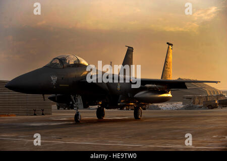 F-15E Strike Eagle No. 89-0487 sits in its spot at Bagram Air Field, Afghanistan, Jan. 13, 2012. No. 89-0487 is a highly credited aircraft, being the only F-15 to successfully complete an air-to-air kill; an achievement that the aircraft reached in 1991 while serving in Operation Desert Storm, and now the only F-15 to log 10,000 hours of flying time. Stock Photo