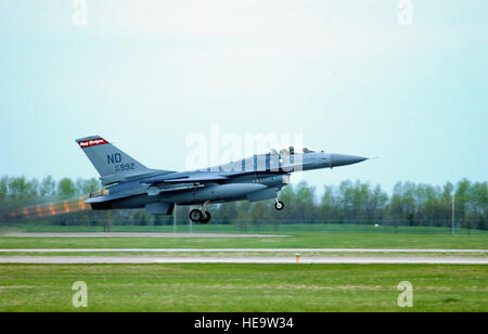 US Air Force (USAF) Major (MAJ) Kent R. Olson, a F-16C Fighting Falcon aircraft pilot assigned to the 178th Fighter Squadron (FS), 119th Fighter Wing (FW), North Dakota (ND) Air National Guard (ANG) “ Happy Hooligans,” takes off for a record setting mission on the flight line at Fargo, ND. The Unit has surpassed the 60,000 accident-free flying hours mark in the aircraft overall, and has amassed over 132,400 hours without a Class A mishap, covering more than 30 years. Stock Photo