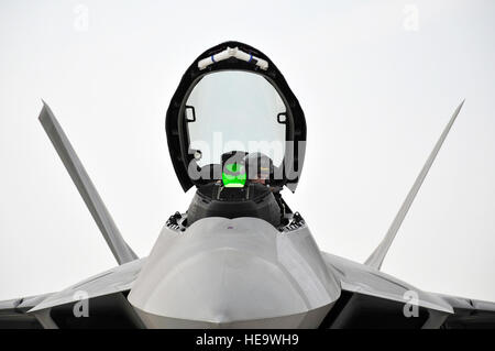 Capt. Blaine Jones, 1st Fighter Wing pilot, checks the cockpit of an F-22 Raptor before closing the canopy Nov. 30, 2009, at an airfield in Southwest Asia.  Captain Jones is participating in the Iron Falcon exercise while on temporary duty from Langley Air Force Base, Va. He is from Kingman, Kan. Tech. Sgt. Charles Larkin Sr) Stock Photo