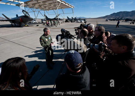 Maj. Gen. Jay Silveria, U.S. Air Force Warfare Center commander, answers questions from local media members after the arrival of the U.S. Air Force Weapons School’s first assigned F-35A Lightning II at Nellis Air Force Base, Nev., Jan. 15, 2015. The F-35 was flown directly from the Lockheed Martin plant in Fort Worth, Texas.  Airman 1st Class Mikaley Towle) Stock Photo