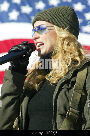 FORT BRAGG, N.C. -- Faith Hill sings during a free concert she performed for people from here and nearby Pope Air Force Base on Feb. 13.  The three-time Grammy Award-winning country musician performed a live five-song concert as a tribute to America’s armed forces and as part of a live broadcast of ABC’s 'Good Morning America.'  Airman 1st Class Jason Neal) Stock Photo