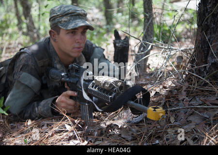 A U.S. Army Ranger student, assigned to the Airborne and Ranger Training Brigade, pulls security behind cover at a patrol base on Camp Rudder, Eglin Air Force Base, Fl., July 8, 2016. The Florida Phase of Ranger School is the third and final phase that these Ranger students must complete to earn the coveted Ranger Tab.  Sgt. Austin Berner Stock Photo