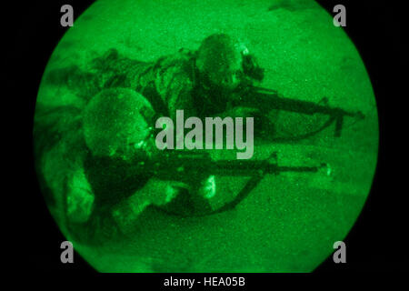 A group of U.S. Army Ranger students, assigned to the Airborne and Ranger Training Brigade, fire their assigned weapons onto their objective on Santa Rosa Island, near Eglin Air Force Base, Fl., July 8, 2016. The Florida Phase of Ranger School is the third and final phase that these Ranger students must complete to earn the coveted Ranger Tab.  Sgt. Austin Berner Stock Photo