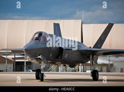 Maj. Gen. Jay Silveria, U. S. Air Force Warfare Center commander, steers his F-35A Lightning II along the yellow taxi line prior to a hot pit refueling session during his final flight qualification Sept. 26 at Eglin Air Force Base, Fla.  Silveria became the first general officer in the Department of Defense to qualify in the fifth generation fighter.  He completed his training with back-to-back flights and hot pit refueling.  Samuel King Jr.) Stock Photo