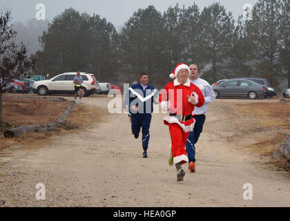 Fort Bragg Airmen and Soldiers participate in the Air Force’s annual Operation Toy Trot 5K race here Dec. 3, collecting toys for the annual Randy Oler Memorial Operation Toy Drop scheduled for Dec. 5-7. Over 150 service members dressed in holiday and fitness attire, donated toys and competed in the 5K race around the Pope Field flight line to help kickoff this year’s U.S. Army Civil Affairs and Psychological Operations Command’s (Airborne) annual Operation Toy Drop. Over its 17-year span, Operation Toy Drop has collected and distributed thousands of toys for children in the Sandhills, N.C., ar Stock Photo