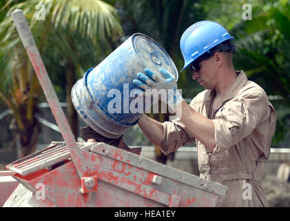 U.S. Marine Sgt. Caleb Rey, a combat engineer with a 271st Marine Wing Support Squadron, 2nd Marine Air Wing, out of Marine Corps Air Station Cherry Point, N.C.,  creates mortar at the Gabriela Mistral primary school construction site in Ocotes Alto, Honduras, June 9, 2015. The school project is one part of the New Horizons Honduras 2015, an annual humanitarian and training exercise organized by U.S. Southern Command. New Horizons was launched in the 1980s and is an annual joint humanitarian assistance exercise that U.S. Southern Command conducts with a partner nation in Central America, South Stock Photo