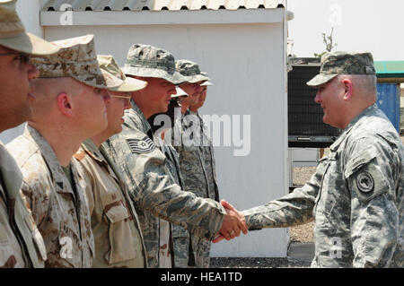 U.S. Army Gen. Carter Ham, U.S. Africa Command commander, shook hands with service members assigned to  the Combined Joint Task Force-Horn of Africa on March 13. Ham visited CJTF-HOA troops three days after assuming command of AFRICOM on March 9 in Stuttgart, Germany. During his visit, Ham met CJTF-HOA leaders, the Djiboutian chief of defense and the U.S. Ambassador to Djibouti.  Staff Sgt. R. J. Biermann Stock Photo