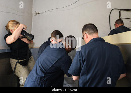 116th Civil Engineer Squadron airmen, Georgia Air National Guard, install wiring on a commercial washing machine at an elderly institution in Yerevan, Armenia, on May 16, 2016, as part of a European Command Humanitarian Civic Assistance project. Stock Photo
