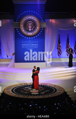 President Barack Obama dances with his wife and first lady of the United States, Michelle Obama, while Jennifer Hudson serenades them during the 2013 Commander in Chief inaugural ball at the Walter E. Washington Convention Center in Washington, Jan. 21, 2013.  Throughout the 57th Presidential Inauguration, the Obama and Biden families have taken the opportunity to highlight the spirit of service and selflessness seen everyday U.S. military men, women and their families. (U.S. Air FOrce  Chief Master Sgt. Robert W. Valenca Stock Photo