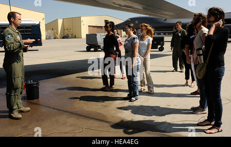 Maj. Nathan Loucks, 28th Operations Support Squadron chief of wing scheduling, gives spouses of Ellsworth airmen a brief introduction to the B-1 bomber airframe during a Heartlink orientation on the flightline at Ellsworth Air Force Base, S.D., July 15, 2013. Elements of the quarterly program include presentations from 28th Bomb Wing leadership, the 28th BW Protocol Office, the 28th Medical and Mission Support Groups, along with a tour of a B-1 static display.  Airman 1st Class Ashley J. Thum Stock Photo