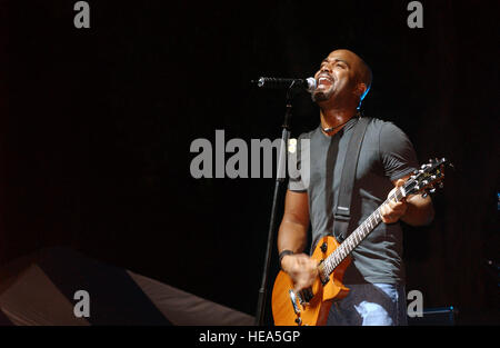 Hootie and the Blowfish lead singer Darius Rucker performs one of his many hit songs along with his band, during a free concert sponsored by the Air Force Reserve Command (AFRCOM) at Hickam Air Force Base (AFB), Hawaii (HI). Stock Photo