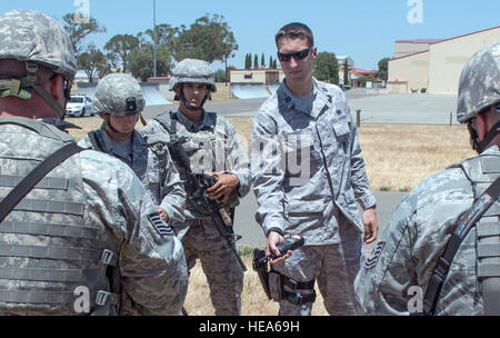 An anti-hijacking exercise conducted by the 60th Air Mobility Wing and other outside agencies played out at Travis Air Force Base, Calif., June 23, 2015.  A C-17 Globemaster played the role of the hijacked aircraft where a crew member took control trying to get to the Philippines to join the Islamic State of Iraq (ISIS). The aircraft was intercepted and turned back to Travis AFB by two Western  Air Defense Air National Guard F-15 Eagles out of Fresno, California and forced to land. After a brief negotiation process, members of the 60 Security Forces Squadron stormed the plane, neutralized the  Stock Photo