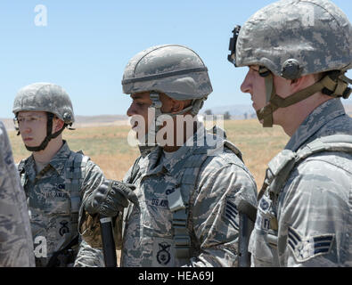 An anti-hijacking exercise conducted by the 60th Air Mobility Wing and other outside agencies played out at Travis Air Force Base, Calif., June 23, 2015.  A C-17 Globemaster played the role of the hijacked aircraft where a crew member took control trying to get to the Philippines to join the Islamic State of Iraq (ISIS). The aircraft was intercepted and turned back to Travis AFB by two Western  Air Defense Air National Guard F-15 Eagles out of Fresno, California and forced to land. After a brief negotiation process, members of the 60 Security Forces Squadron stormed the plane, neutralized the  Stock Photo