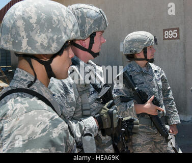 An anti-hijacking exercise conducted by the 60th Air Mobility Wing and other outside agencies played out at Travis Air Force Base, Calif., June 23, 2015.  A C-17 Globemaster played the role of the hijacked aircraft where a crew member took control trying to get to the Philippines to join the Islamic State of Iraq (ISIS). The aircraft was intercepted and turned back to Travis AFB by two Western  Air Defense Air National Guard F-15 Eagles out of Fresno, California and forced to land. After a brief negotiation process, members of the 60 Security Forces Squadron stormed the plane, neutralized the  Stock Photo