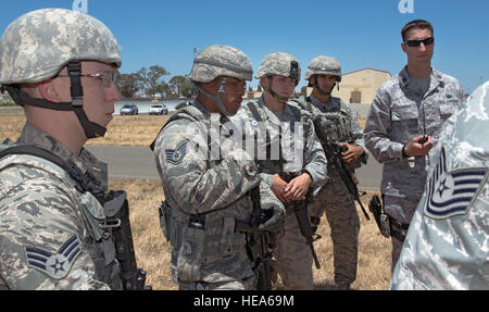 An anti-hijacking exercise conducted by the 60th Air Mobility Wing and other outside agencies played out at Travis Air Force Base, Calif., June 23, 2015.  A C-17 Globemaster played the role of the hijacked aircraft where a crew member took control trying to get to the Philippines to join the Islamic State of Iraq (ISIS). The aircraft was intercepted and turned back to Travis AFB by two Western  Air Defense Air National Guard F-15 Eagles out of Fresno, California and forced to land. After a brief negotiation process, members of the 60 Security Forces Squadron stormed the plane, neutralized the  Stock Photo