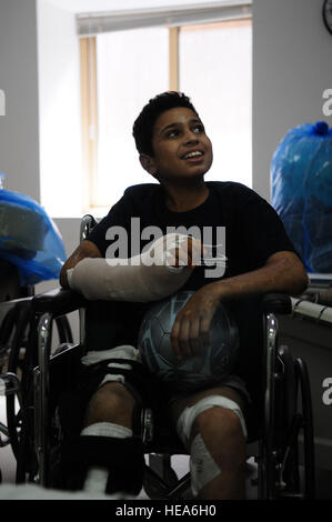 Ahmad, a 14-year-old Iraqi victim of a mortar explosion, prepares to leave the Air Force Theater Hospital at Joint Base Balad, Iraq, Sept. 17, 2009, after spending more than a month recovering from his injuries. Stock Photo