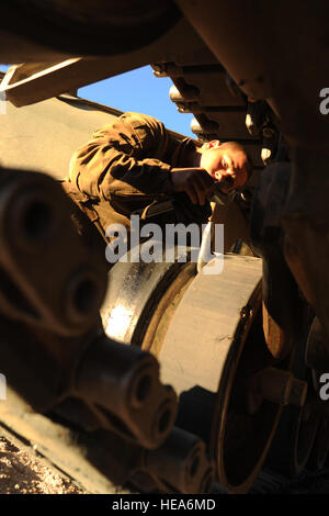 U.S. Marine Corps Lance Cpl. Dylum McVey, 1st Tank Battalion, Company D, Marine Corps Air Ground Combat Center Twentynine Palms (MCAGCC), Calif., adjusts a wrench Feb. 12, 2015, during Integrated Training Exercise 2-15 at MCAGCC. MCAGCC conducts relevant live-fire combined arms training, urban operations and joint/coalition level integration training that promotes operational forces readiness.  Tech. Sgt. Daniel St. Pierre Stock Photo