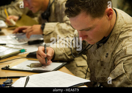 U.S. Marine Corps Capt. Matthew Riley, forward air controller, 1st Battalion, 4th Marines, Charlie Company, Camp Pendleton, Calif., preps a battle board while participating in a combined arms simulation trainer event during Integrated Training Exercise 2-15 at Marine Corps Air Ground Combat Center Twentynine Palms (MCAGCC), Calif., Jan. 29, 2015. MCAGCC conducts relevant live-fire combined arms training, urban operations, and Joint/Coalition level integration training that promotes operational forces readiness.  Tech. Sgt. Matthew Smith Stock Photo