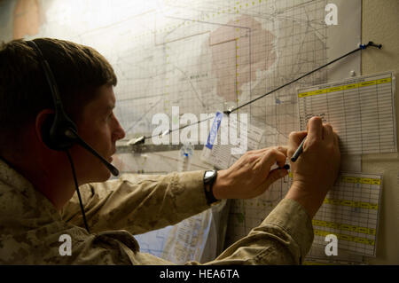 U.S. Marine Corps Capt. Matthew Hays, weapons company commander, 1st Battalion, 4th Marines, Weapons Company, Camp Pendleton, Calif., updates a coordination sheet  while participating in a combined arms simulation trainer event during Integrated Training Exercise 2-15 at Marine Corps Air Ground Combat Center Twentynine Palms (MCAGCC), Calif., Jan. 29, 2015. MCAGCC conducts relevant live-fire combined arms training, urban operations, and Joint/Coalition level integration training that promotes operational forces readiness.  Tech. Sgt. Matthew Smith Stock Photo