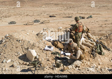 A U.S. Marine Corps fire support team, 1st Battalion, 4th Marines, Camp Pendleton, Calif., directs artillery, mortar fire and close air support while participating in a mechanized assault course event during Integrated Training Exercise 2-15 at Marine Corps Air Ground Combat Center Twentynine Palms (MCAGCC), Calif., Feb. 1, 2015. MCAGCC conducts relevant live-fire combined arms training, urban operations, and joint/coalition level integration training that promotes operational forces' readiness.  Staff Sgt. Heather Cozad Staley Stock Photo