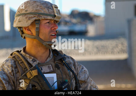 U.S. Marine Capt. Tim Agoulnik, Commander, Company A, 1st Battalion, 4th Marine Regiment, Marine Corps Base Camp Pendleton, Calif., walks a patrol while conducting Military Operations in Urban Terrain (MOUT) during Integrated Training Exercise 2-15 at Marine Corps Air Ground Combat Center (MCAGCC) Twentynine Palms Calif., Feb. 18, 2015. MCAGCC conducts relevant live-fire combined arms training, urban operations, and Joint/Coalition level integration training that promote operational forces readiness.  Staff Sgt. Kyle Brasier Stock Photo