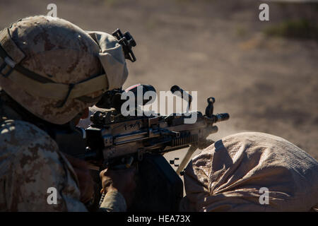 U.S. Marine Lance Cpl. Ryan Rios, SAW gunner assigned to 1st Battalion, 4th Marines, 1st Platoon, Marine Corps Base Camp Pendleton, Calif., fires an M249 Squad Automatic Weapon (SAW) during Integrated Training Exercise 2-15 at Marine Corps Air Ground Combat Center Twentynine Palms (MCAGCC), Calif., Feb. 10, 2015. MCAGCC conducts relevant live-fire combined arms training, urban operations, and joint/coalition level integration training that promotes operational forces' readiness.  Tech. Sgt. Joselito Aribuabo Stock Photo