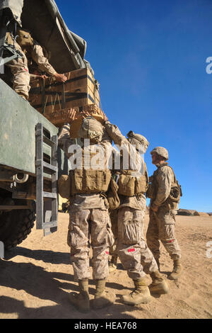 U.S. Marines assigned to Combat Logistics Battalion, Headquarters Regiment, Camp Pendleton, Calif., load Meals, Ready-to-Eat (MRE) into a military truck for transport during Integrated Training Exercise 2-15 at Marine Corps Air Ground Combat Center Twentynine Palms (MCAGCC), Calif., Feb. 11, 2015. MCAGCC conducts relevant live-fire combined arms training, urban operations, and joint/coalition level integration training that promotes operational forces' readiness.  Tech. Sgt. Joselito Aribuabo Stock Photo