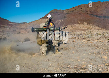 A U.S. Marine assigned to Combat Logistics Group 1, Marine Corps Base Camp Pendleton, Calif., fires an AT4 Anti-tank Rocket Propelled Grenade while on a training convoy during Integrated Training Exercise 2-15 at Marine Corps Air Ground Combat Center (MCAGCC) Twentynine Palms Calif., Feb. 15, 2015. MCAGCC conducts relevant live-fire combined arms training, urban operations, and joint/coalition-level integration training that promote operational forces readiness.  Staff Sgt. Kyle Brasier Stock Photo