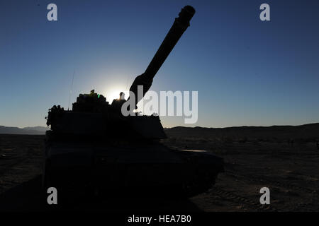 A U.S. Marine Corps M1A1 Abrams tank awaits for mission objectives during Integrated Training Exercise 2-15 at Marine Corps Air Ground Combat Center Twentynine Palms (MCAGCC), Calif., Feb. 17, 2015. MCAGCC conducts relevant live-fire combined arms training, urban operations, and Joint/Coalition level integration training that promotes operational forces readiness.  Technical Sgt. Joselito Aribuabo Stock Photo
