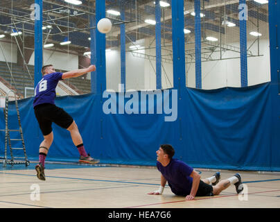 Jared Bunn, (left), hits a volleyball after a set from Salaman Semy, during a practice at the Buckner Physical Fitness Center before a volleyball game on Joint Base Elmendorf-Richardson, Alaska, Feb. 17, 2015. Bunn and Semy are members of the Outkastz volleyball team. Bunn is a broadcaster assigned to 673d Air Base Wing Public Affairs office and Semy is an airborne missions systems operator assigned to the 962nd Airborne Air Control Squadron. Airman 1st Class Tammie Ramsouer) Stock Photo