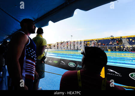 U.S. Navy Retired Navy Electrician’s Mate 3rd Class Michael Roggio of Team U.S. stands on the pool deck during the swimming finals for the Invictus Games 2016 in Orlando, Fla. May 11, 2016. The Invictus Games are composed of 14 nations, over 500 military competitors, competing in 10 sporting events May 8-12, 2016.  Staff Sgt. Carlin Leslie Stock Photo