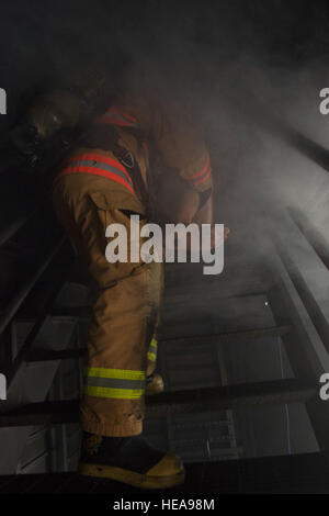 A U.S. Air Force Academy cadet evacutates a simulated victim from a smoke filled room while conducting search and rescue training on Joint Base Elmendorf-Richardson, Alaska, May 20, 2015. The training provided the cadets, studying civil engineering, the opportunity to work with Airmen and noncommissioned officers, assigned to the 673rd Civil Engineer Squadron, in their field of choice. Alejandro Pena) Stock Photo